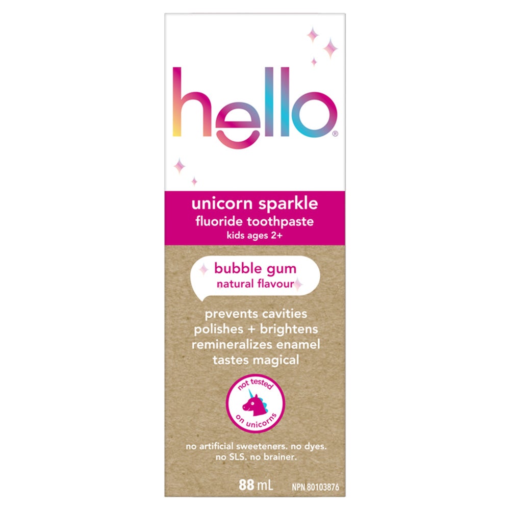 A carton of Hello Unicorn Sparkle fluoride toothpaste for kids ages 2+. The carton features an illustration of a unicorn and text that reads "bubble gum," "natural flavour," "prevents cavities polishes + brightens remineralizes enamel," "tastes magical," and "not tested on unicorns." It also lists the features "no artificial sweeteners. no dyes. no SLS. no brainer," and indicates the size is 88 mL.
