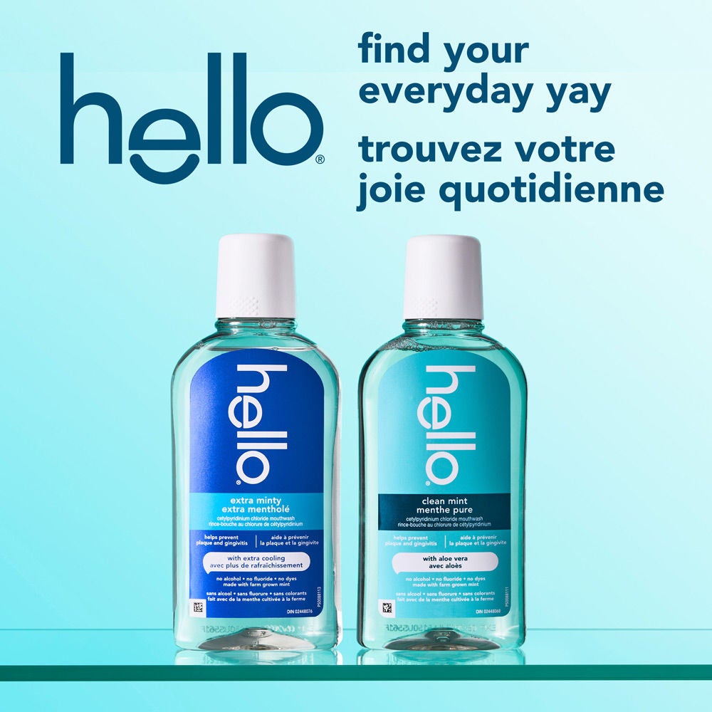 Flacon de rince-bouche hello Clean à la menthe, sans alcool, entouré d’une éclaboussure d’eau avec le texte « Rafraîchit de fou