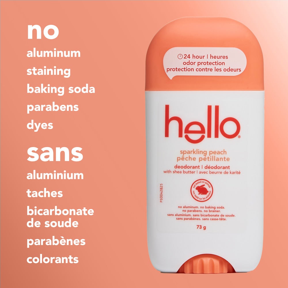 A close-up of a hello sparkling peach deodorant stick standing upright on a peach background. The image highlights text stating "no aluminum, staining, baking soda, parabens, dyes.