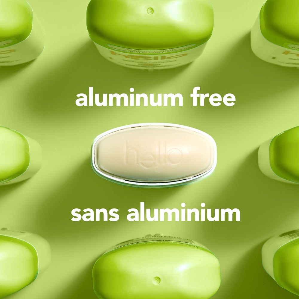 A top-down view of several green  deodorant containers arranged around a central oval container embossed with the word "hello." The image includes the text "aluminum free."