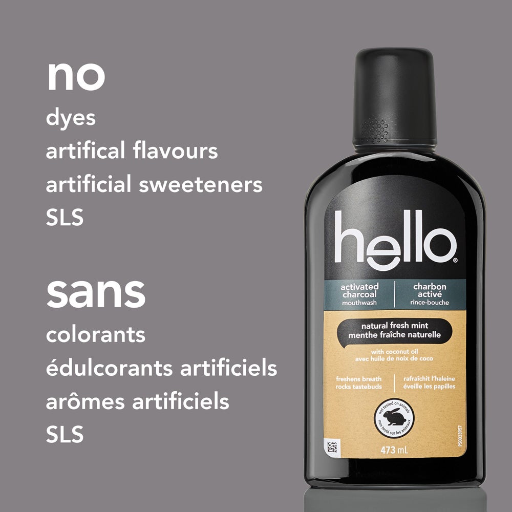 A black bottle of hello activated charcoal mouthwash is centered on a grey background. To the left, white text lists ingredients not in the mouthwash: "no dyes, artificial flavours, artificial sweeteners, SLS."